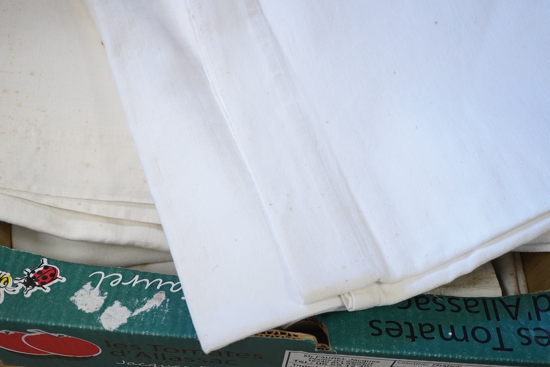 Six French provincial linen sheets each with a red cross stitched monogram to the turn back.